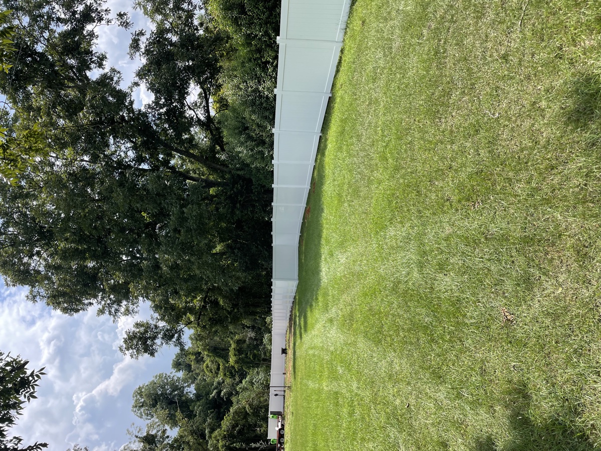 Vinyl fence installation Columbia SC — day 3, crew keeping the line straight